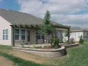 After - Belgard &#039;Dublin Cobble&#039; Patio, Pergola, Belgard Retaining Wall and New Landscaping